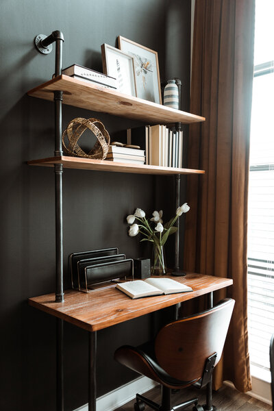 a wooden desk in a bedroom