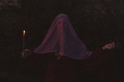 Translucent sheet draped over Miriam's face