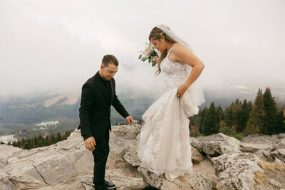 bride and groom on mountain