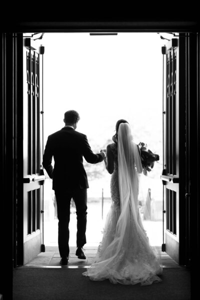 Bride and groom walk up memorial steps at their DC wedding