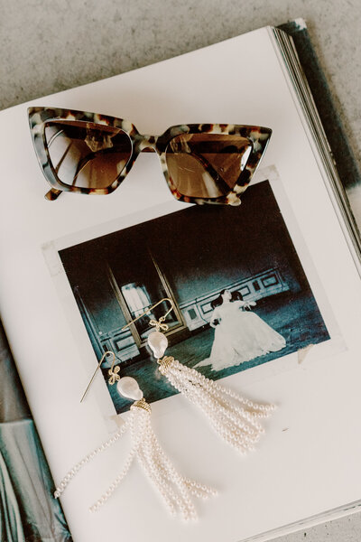 The Lovers Elopement Co - wedding album and sunglasses - elopement styling