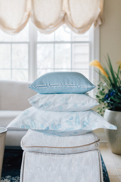 Stack of pillows with patterned pillowcases