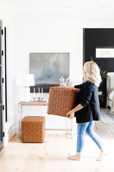 New Jersey interior designer Dana Triano arranges and installs furniture, the final step of the process at Dana Triano Designs