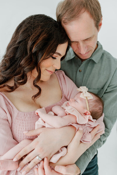 couple holding their new baby