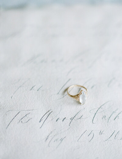antique marquise aquamarine engagement ring with yellow gold, handmade paper, handwritten wedding invitation