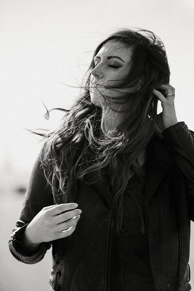 Aspen Dawn with windblown hair in black and white.