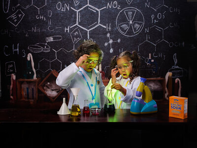 Preforming a science lab experiment by commercial photographer Erica Payne from Austin texas