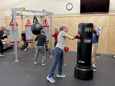 People participating in a Parkinson's exercise class in Eugene at the Parkinson's gym. 