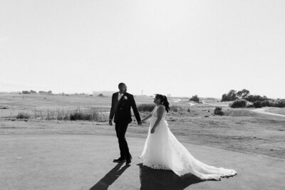 couple walking on golf course