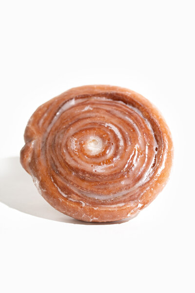 Cinnamon Roll on a White Background - Daylight Donuts