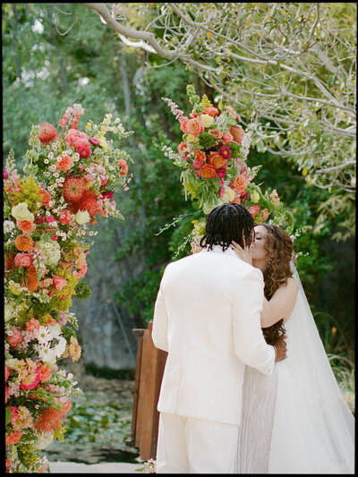 woman with bride and groom