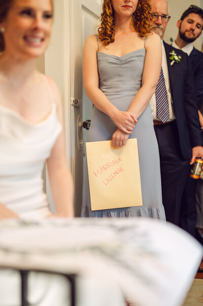Woman holding marriage license