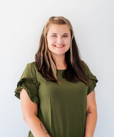Ms. Heather, assistant teacher posing her headshot