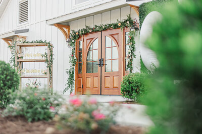 Main entrance double doors with floral decor