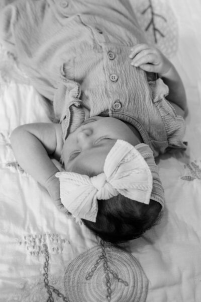 Black & White Photo of baby lying in crib | Maine Newborn Photographer