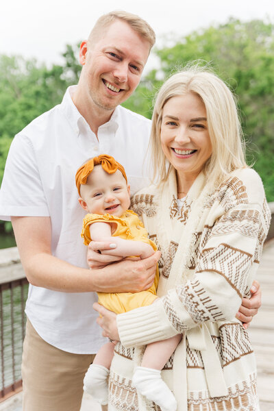 family of three during an outdoor minnesota family portrait session by Yantes Photo