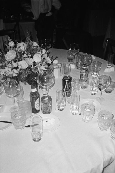 Table littered with empty cocktail and beer glasses at Reception at Curtis Arboretum