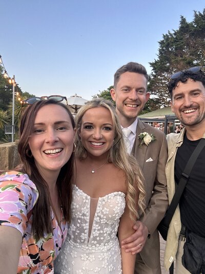 Amy & Nick posing with couple