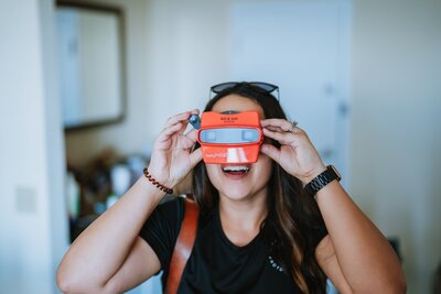 woman holding view master up to her eyes
