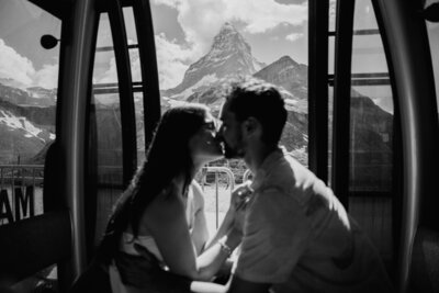 Matterhorn couple kissing in cable lift during elopement