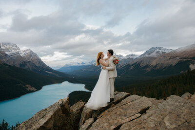 Bride and groom kissing after their elopement at Peyto Lake, Alberta, Canada