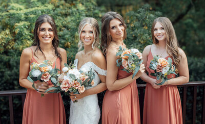 Bride and bridesmaids smiling together | Summer Wedding at English Manor | Ocean Township, New Jersey