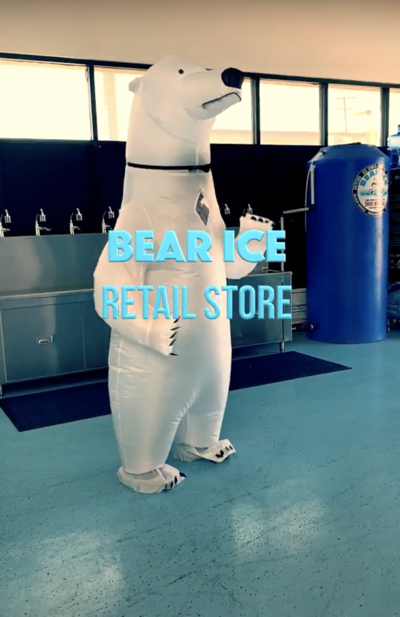 Bear Ice Employee dressed in inflatable polar bear suit dancing in Bear Ice retail store