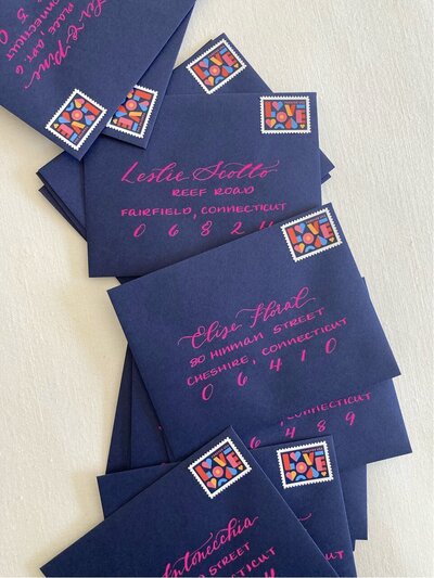 Navy blue envelopes with pink calligraphy for Valentine's Day