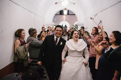 reception grand exit of bride and groom at San Fernando Cathedral wedding venue in downtown San Antonio