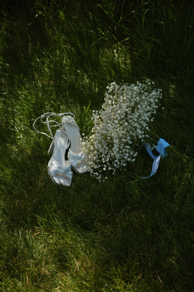 the messy details with shoes and flowers