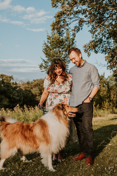 couples photos at the park with their dog 