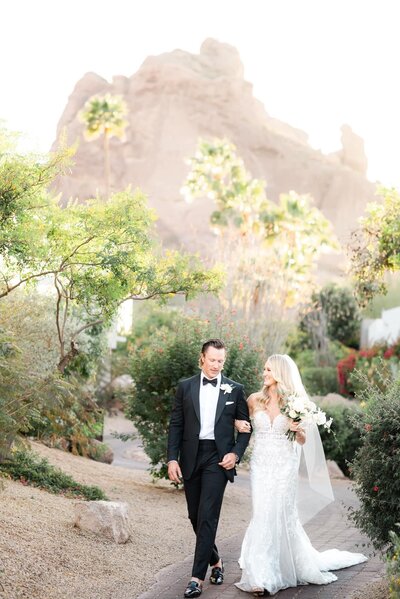 Wedding at the Sanctuary Scottsdale Bride and Groom walking down path with mountain view