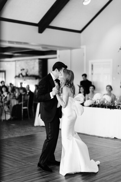 A female guitarist a female bassist and a male violinist playing at a wedding ceremony in Nashville Tennessee