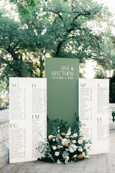 White and green wedding table seating chart with lavish florals at the DAR Constitution Hall