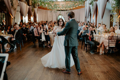 Relive the magic of the bride and groom's first dance in a beautifully decorated reception hall. See more unforgettable wedding dances.