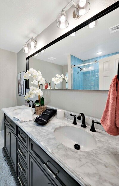 Bathroom vanity of this three-bedroom, two-bathroom vacation rental home with historical charm in Waco, TX.