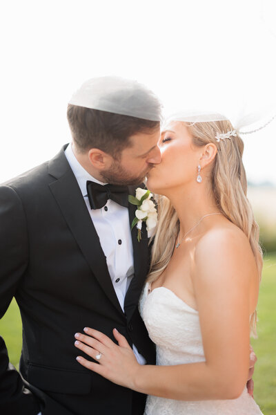 Bride and groom kissing