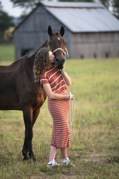 senior girl with horse and dog