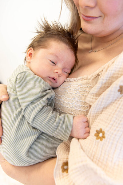 Woman holding her infant 
