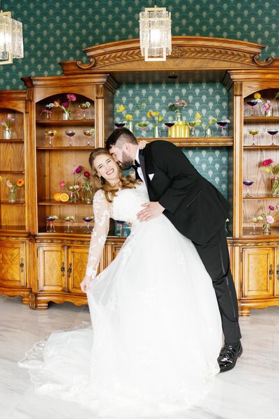 Groom kissing bride at the Homestead