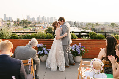Bride and groom kissing at Waymore Hotel wedding ceremony