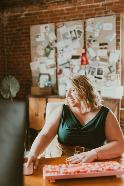 Anika the wedding planner sitting at her desk