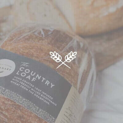 Loaf of bread overlayed with wheat logo