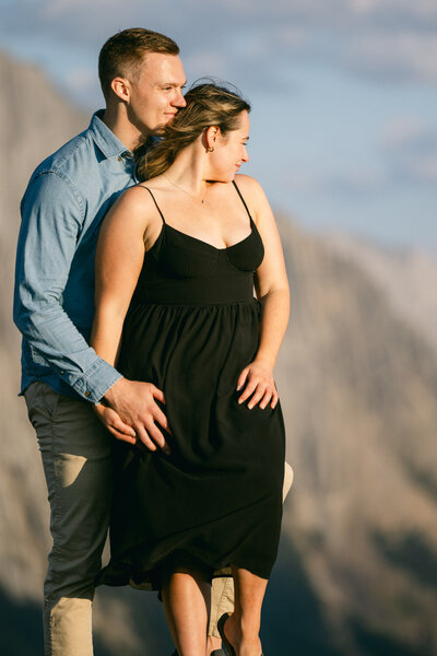 Capture the essence of romance with a photo of the bride and groom embracing at Fairmont Banff Springs Hotel. A perfect moment of love and elegance on their wedding day.