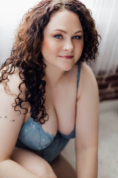 A women looks at a Vancouver Photographer with a little smile on her face