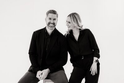 Black and white portrait of Joy and Ben, luxury wedding photographers based in Scottsdale, Arizona, capturing authentic, timeless moments for couples throughout Arizona and destination weddings worldwide.