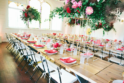 Beautiful wedding reception space with tall floral arrangements