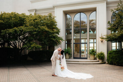 a couple kisses after their wedding ceremony in seattle, washington with washington wedding photographer sarah mismash