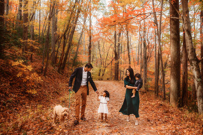 Family walks together along the Blue Ridge Parkway for their Fall Family Photos in Asheville.