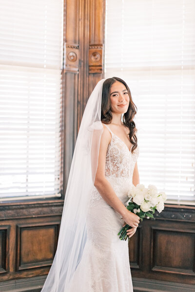 bride closing her eyes while flipping her hair